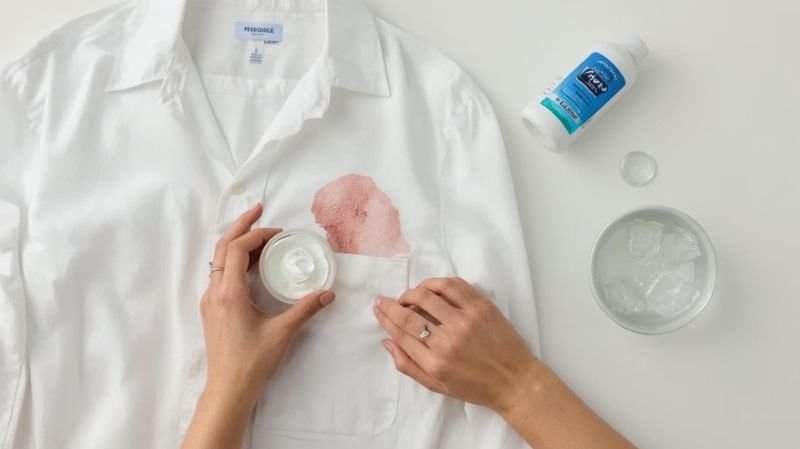 How to Get Foundation Makeup Out of Clothes? Removing lipstick stain from white shirt pocket using shaving cream and cloth.