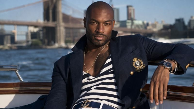 Top 5 Famous Male Models of All Time Tyson Beckford in a Ralph Lauren–inspired suit, showcasing powerful physique, confidence, and high-fashion editorial style