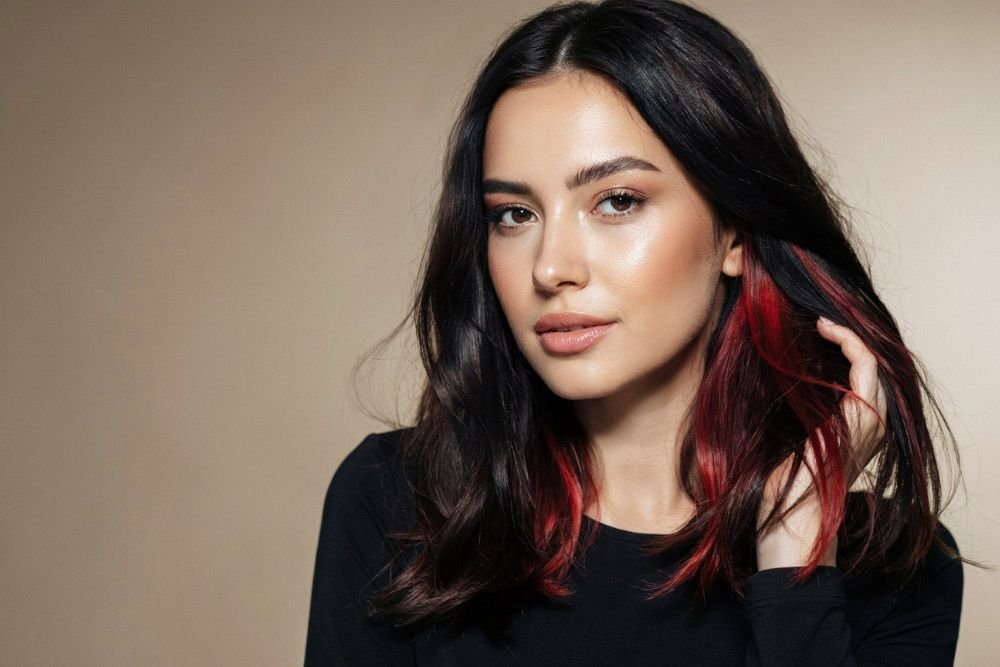 25 Black and Red Hair Streaks Ideas for a Bold New Look Black hair with vibrant red streaks hairstyle inspiration