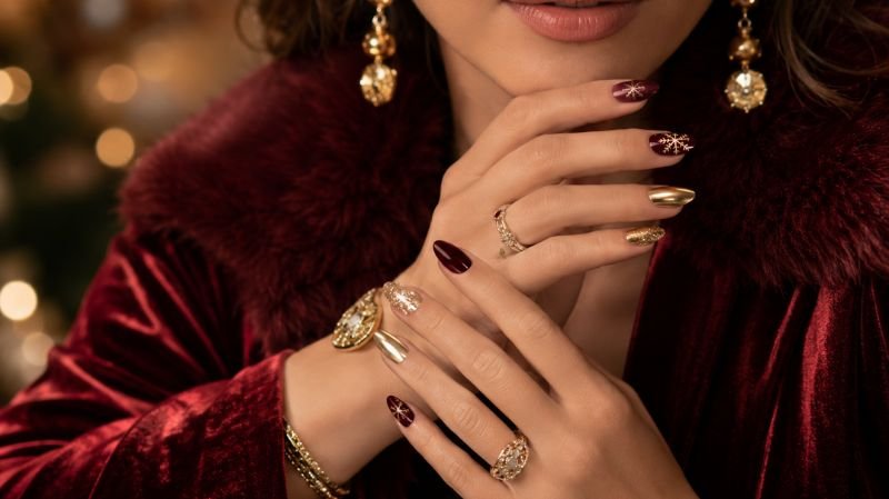 Elegant Christmas nail designs styled with fashion accessories and holiday outfits