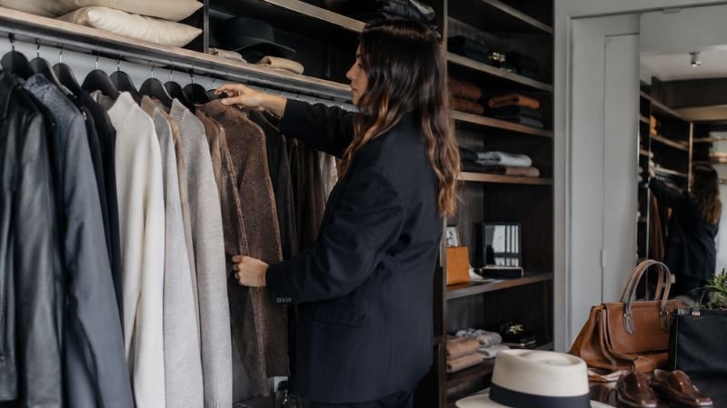 How to Remove Pilling from Clothes Without Damaging Fabric Fashion professional inspecting and maintaining clothing wardrobe pieces
