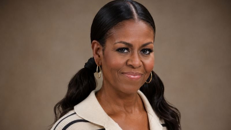Michelle Obama’s Pigtails & Capri Pants: Fashion or Trend? Sophisticated adult pigtail hairstyle with sleek styling showing modern fashion confidence