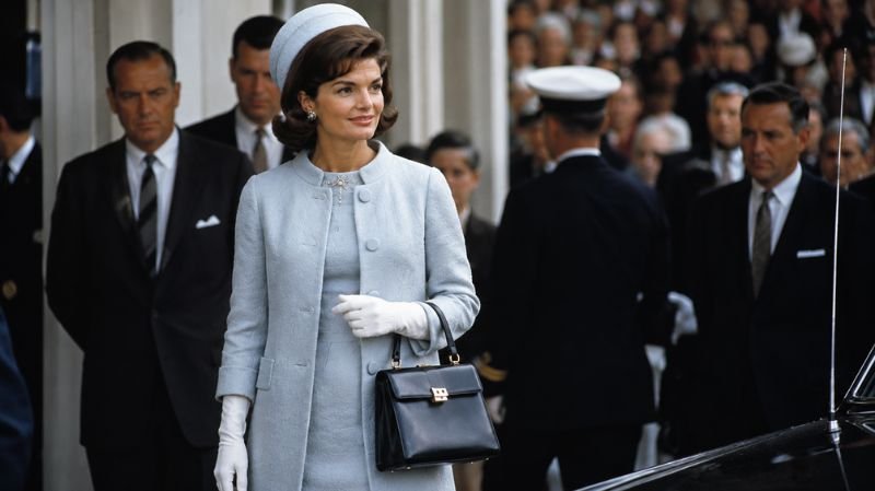 Jackie Kennedy wearing a coordinated Cassini-inspired outfit with accessories