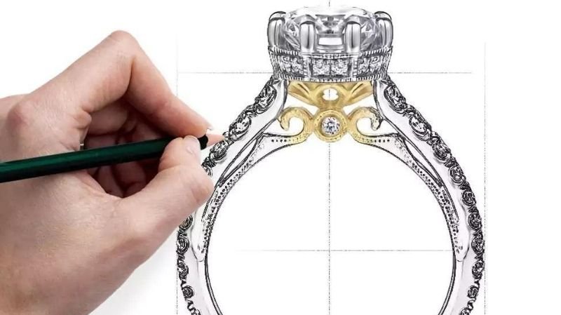 Designing a Custom Engagement Ring in Dallas: A Step-by-Step Guide From Sketch to Setting Jewelry designer sketching an ornate diamond ring setting with intricate gold and silver detailing.