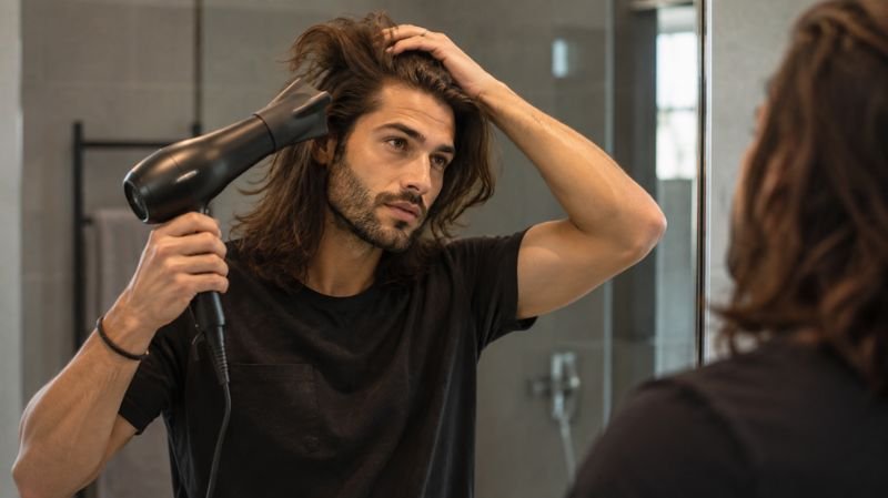Styling a long layered haircut for men