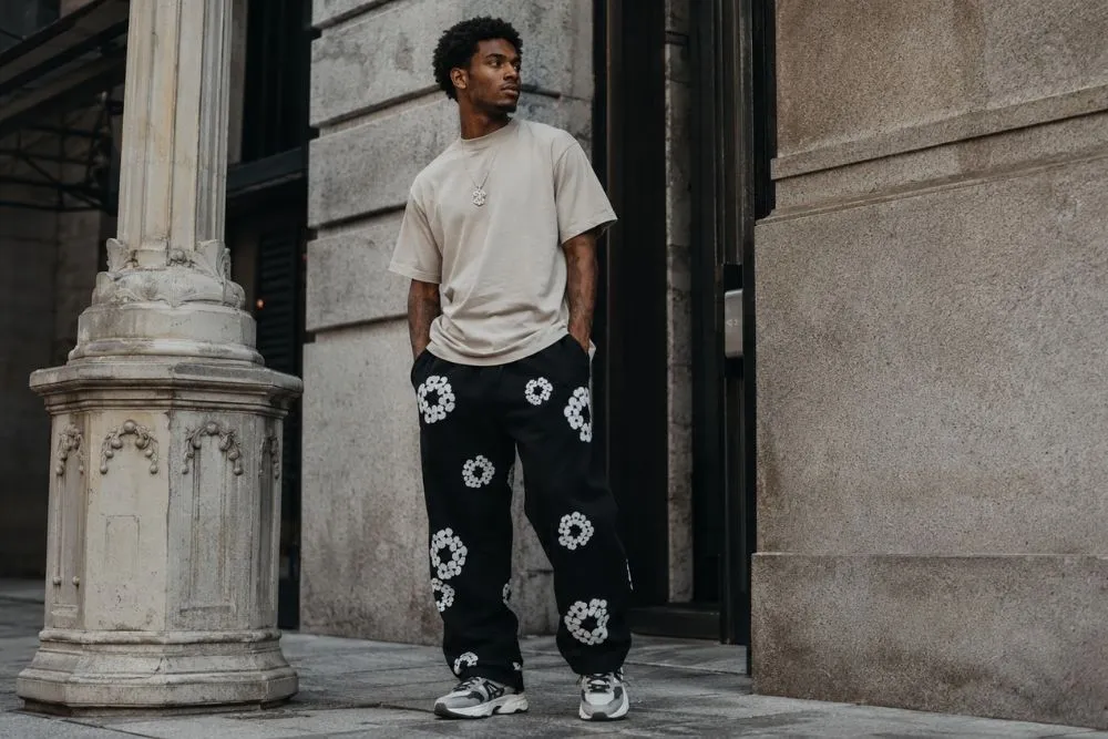 Denim Tears Sweatpants: Styles, Fit, Sizing & Buying Guide Denim Tears sweatpants in a premium streetwear fashion editorial