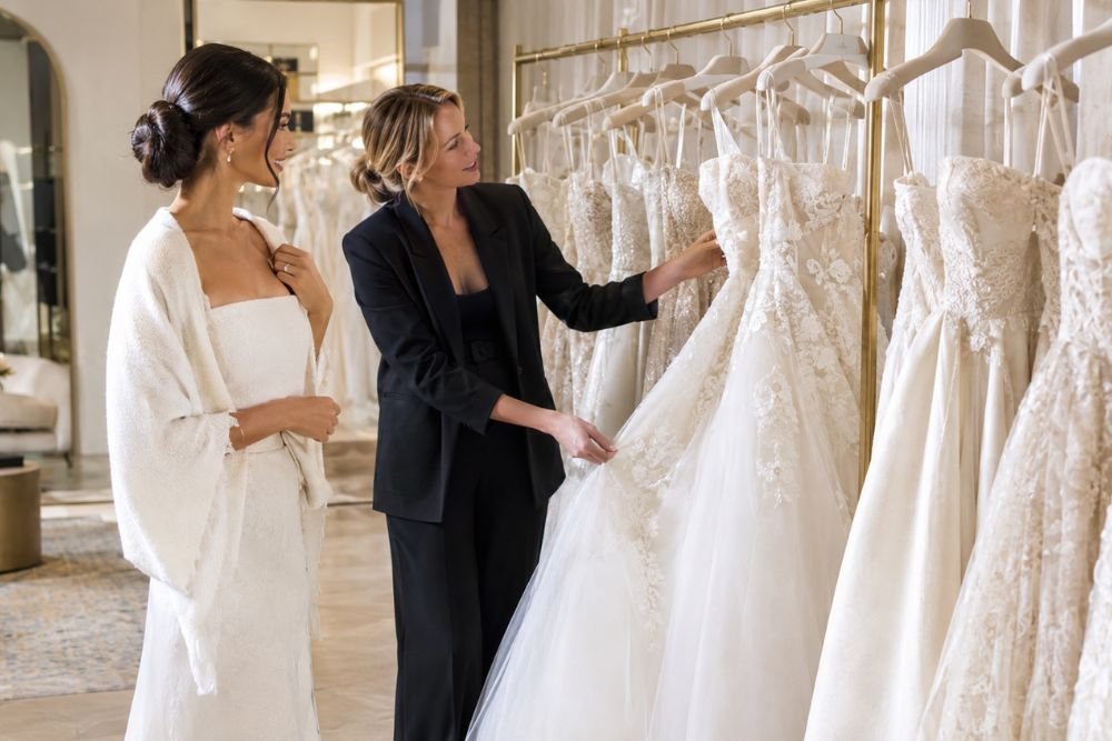 Bride choosing a wedding dress in a bridal boutique